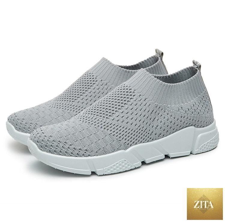 Women slip-on white sneakers by Stevvex with breathable mesh upper, lightweight vulcanize sole, ideal for casual walking and running.