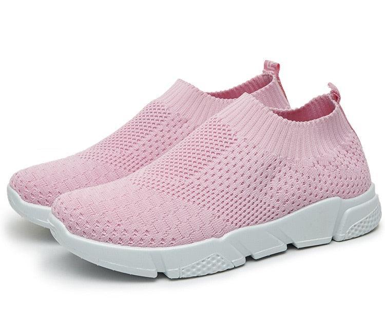Women slip-on white sneakers by Stevvex with breathable mesh upper, lightweight vulcanize sole, ideal for casual walking and workouts.
