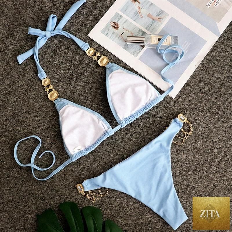 Luxury purple Stevvex bikini set with halter top, rhinestone accents, low waist, tie sides, and crystal diamonds for women’s swimwear.