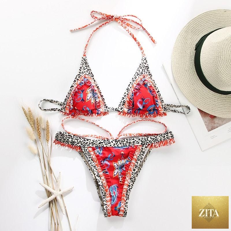Vintage print Stevvex female bikini with ruffles, high cut, halter neck, triangle top, and string detailing for stylish swimwear.