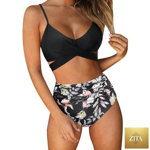 Stevvex modern floral two-piece bikini set with high waist, crisscross design, and colorful flower print for women’s summer swimwear.