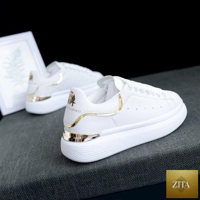 Women's white thick-soled sports sneakers by Stevvex with breathable fabric, lace-up design, ideal for casual, gym, and running.