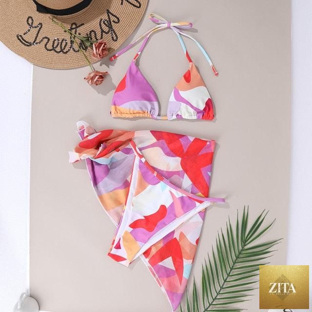 Stevvex 3-piece women's bikini set with high cut swimsuit, halter top, wrap skirt, lace-up details, and triangle backless design.