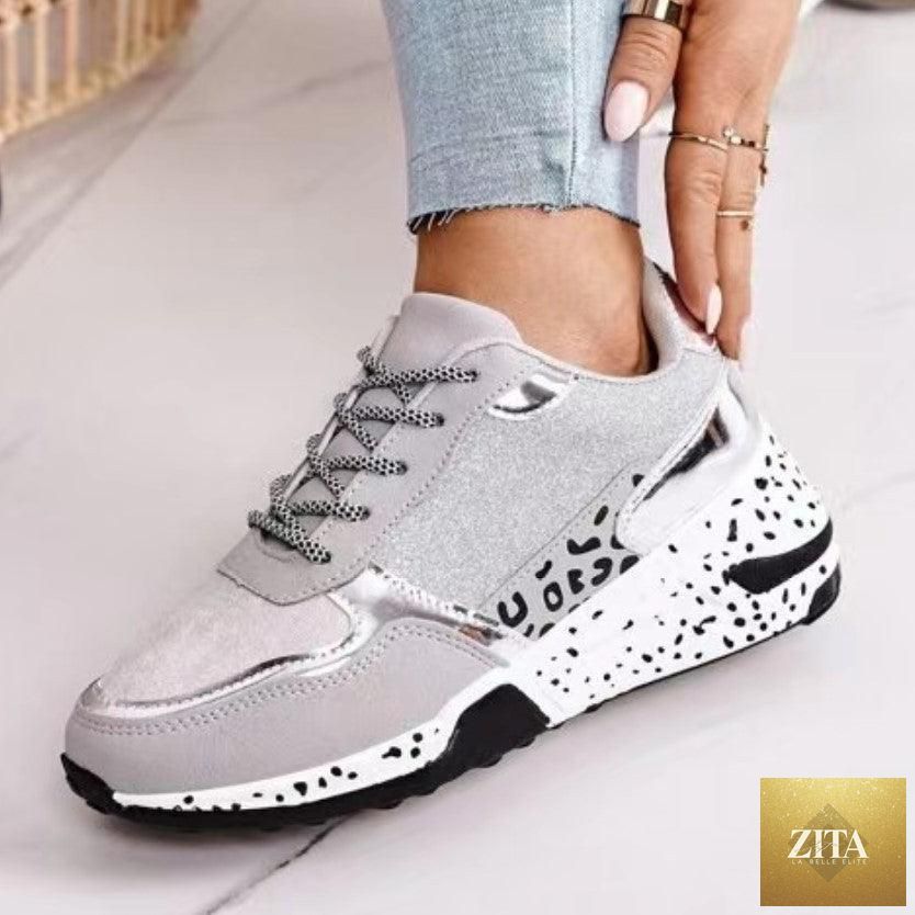 Stevvex women's leopard print sport running sneakers with lace-up design, breathable material, and height-increasing sole for walking and jogging.