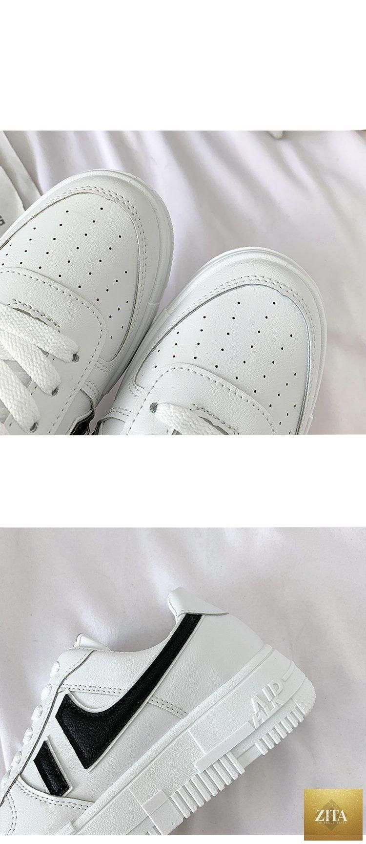 Stevvex white women's casual sneakers with round toe, lace-up design, breathable fabric, flat sole, ideal for walking and daily wear.