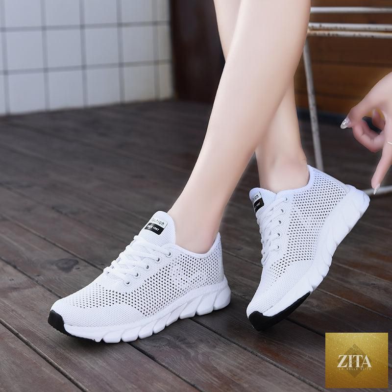 Stevvex women's breathable mesh sneakers with flat design, lightweight, non-slip sole, ideal for running and walking.