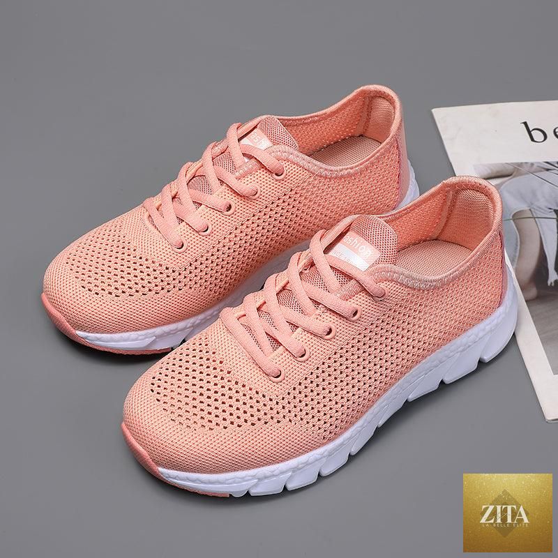 Stevvex women's breathable mesh sneakers with flat design, lightweight, non-slip soles, ideal for running and walking.
