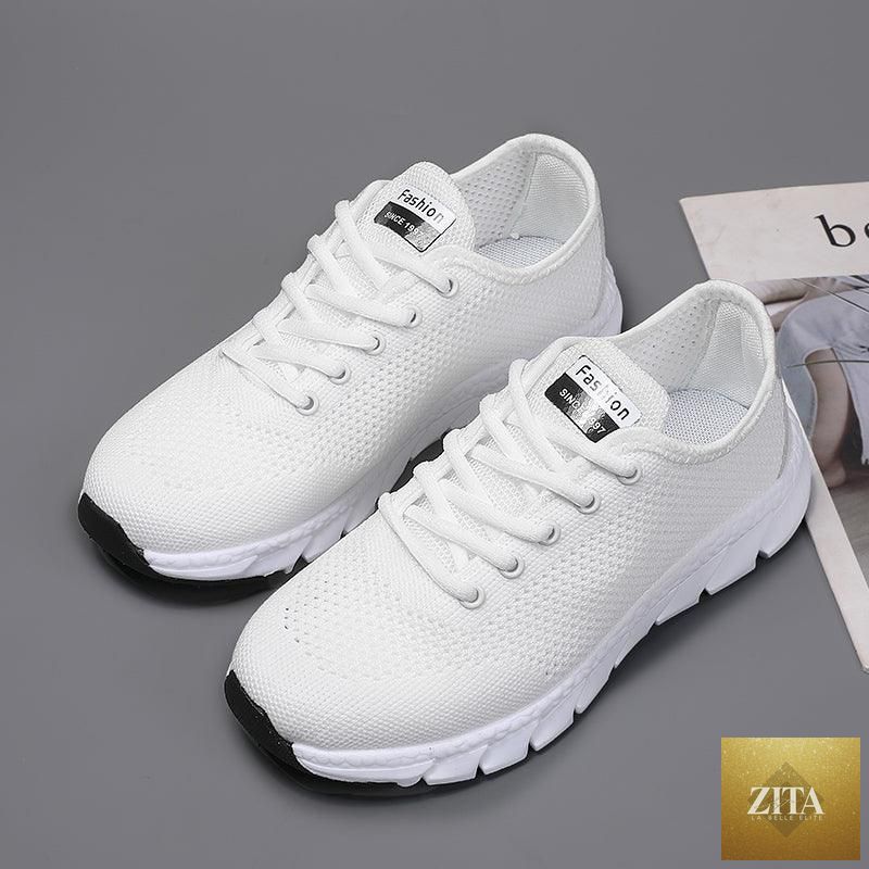 Stevvex women's breathable mesh sneakers with flat design, lightweight, non-slip soles, ideal for running and walking activities.