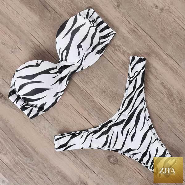 Stevvex leopard bikini set for women, halter triangle top with cheeky bottoms, perfect for summer beach wear and swimming.