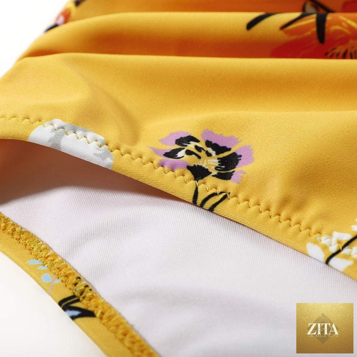 Stevvex modern floral bikini set with high waist crisscross design and string ties, featuring colorful flower print for summer beachwear.