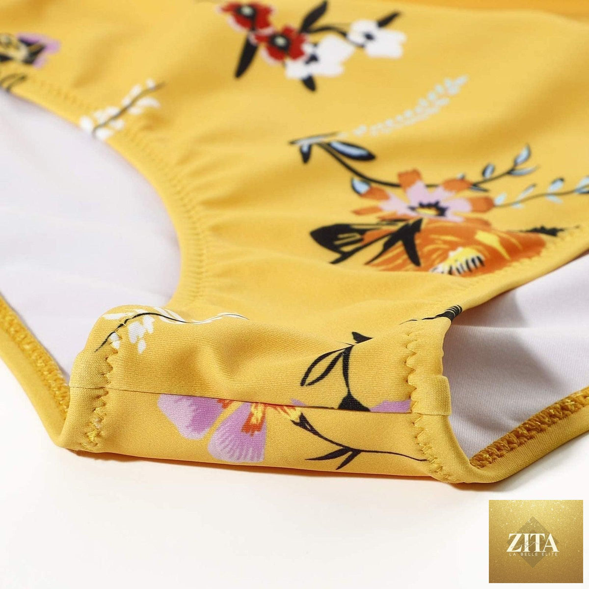Stevvex modern floral two-piece bikini set with high waist, crisscross design, flower print, and solid color swim shorts for women.