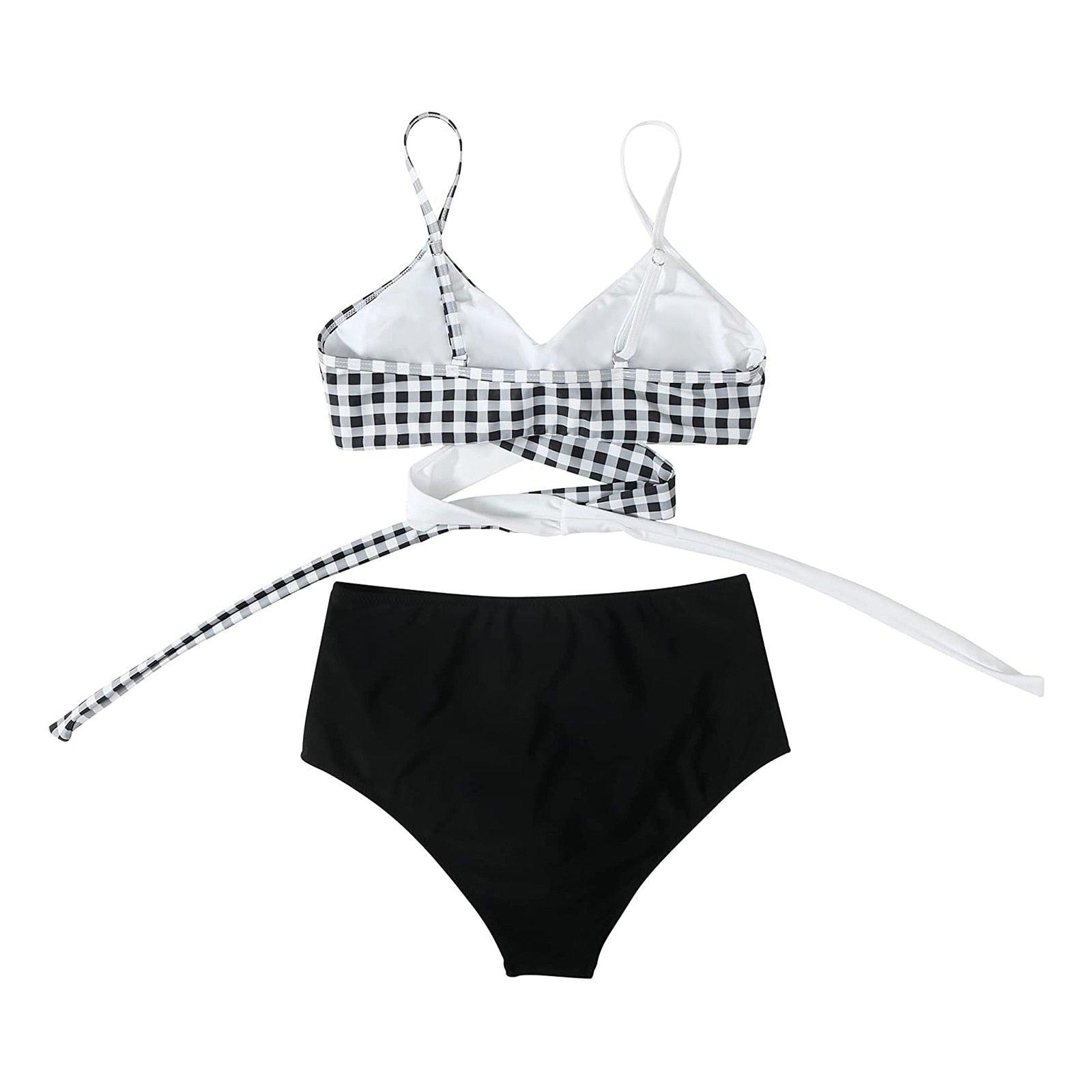 Stevvex modern floral bikini set with high waist, crisscross design, and string ties, featuring a colorful flower print and solid swim shorts.