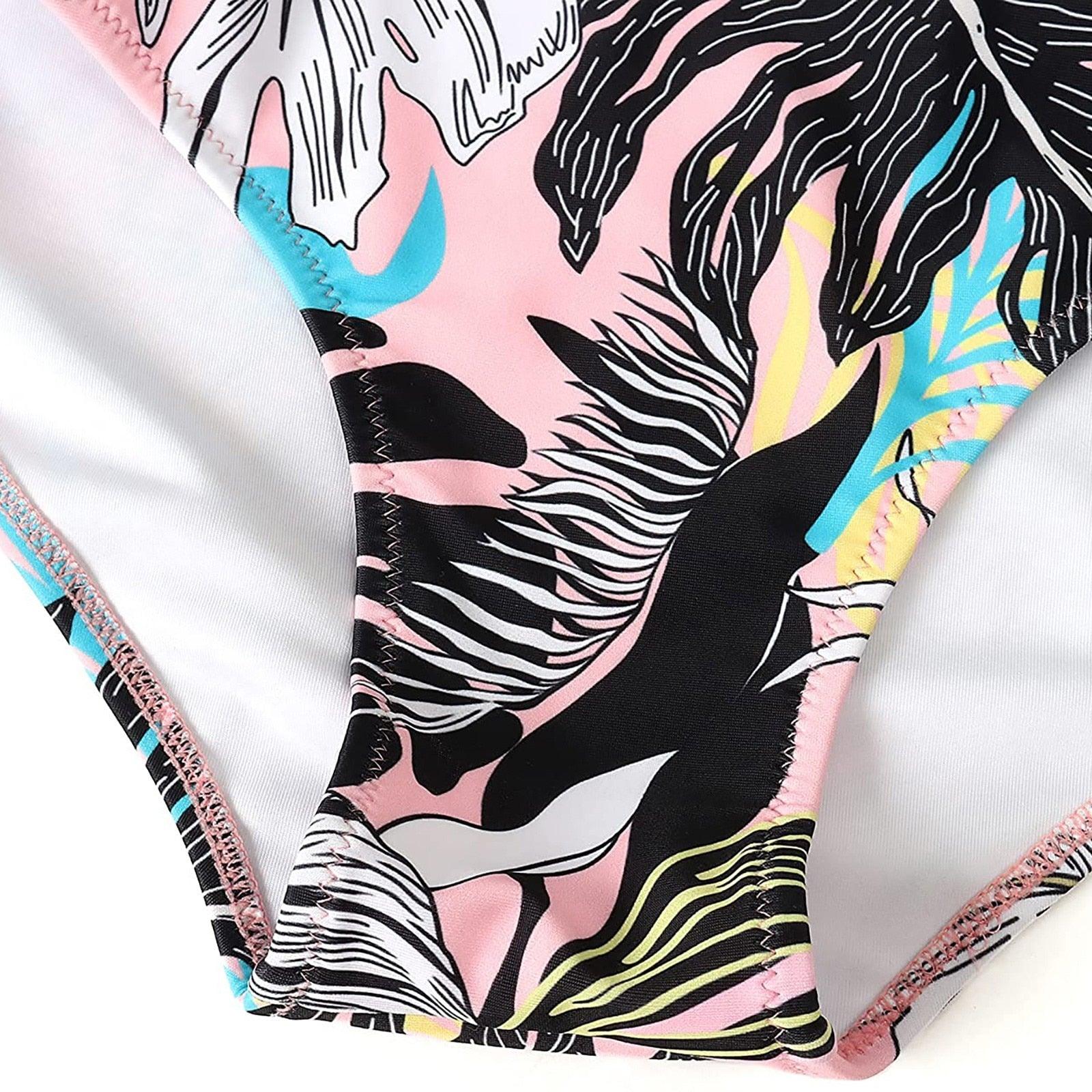 Stevvex women's modern floral bikini set with high waist, crisscross design, and string ties, featuring colorful flower print.
