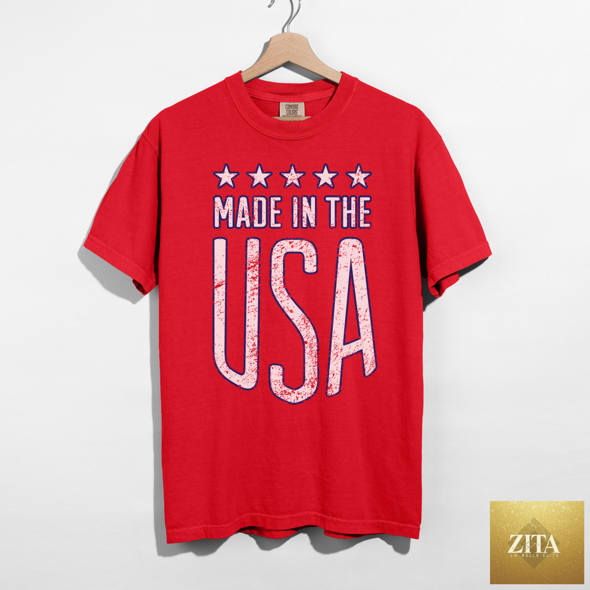 Red patriotic graphic tee by Hey Jude Graphic Tees featuring USA-themed design, made in the USA, casual and stylish for everyday wear.