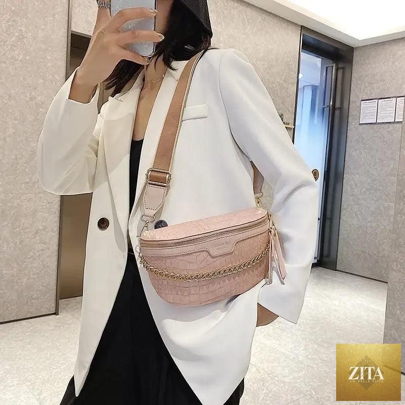 Stylish retro waist bag by Stevvex with PU leather, gold chain strap, and multifunctional design for women.