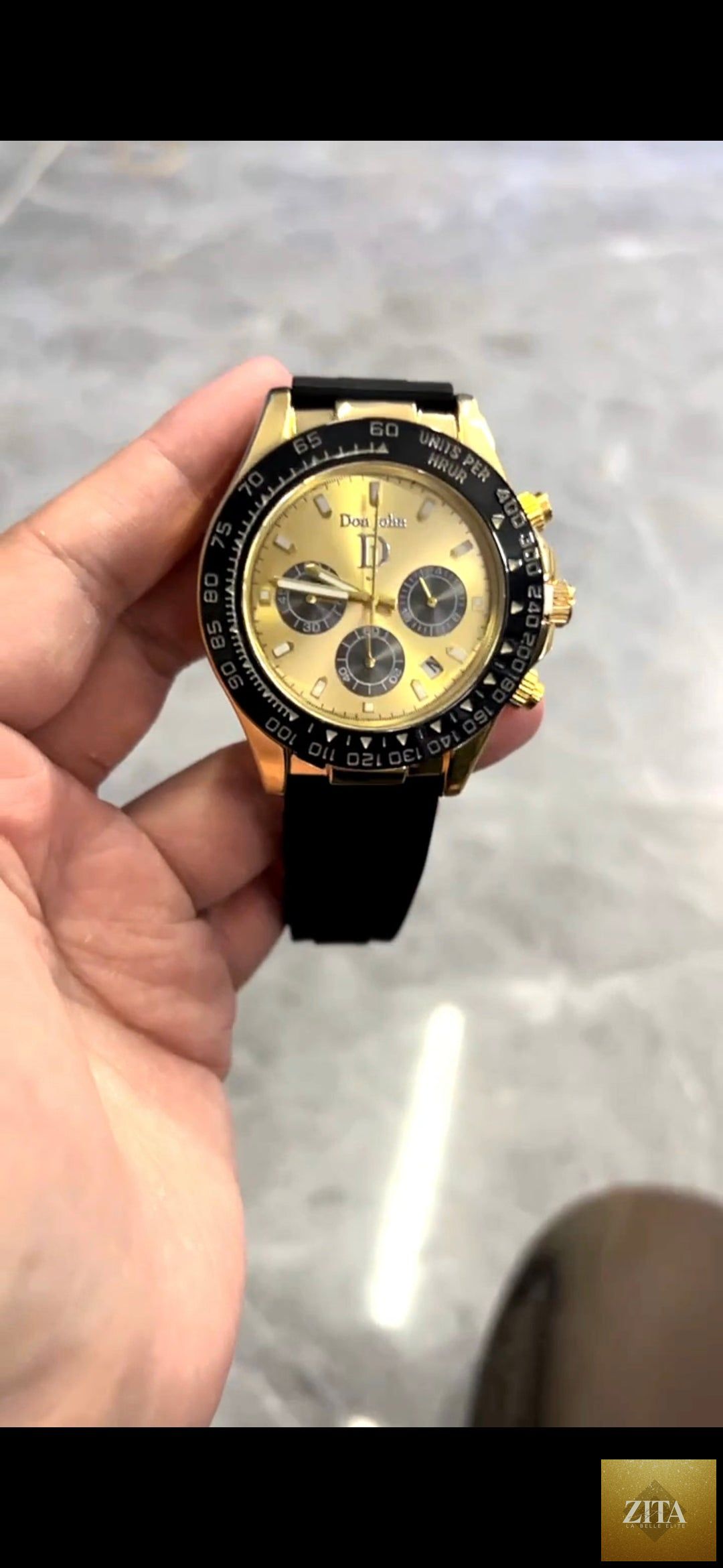Gold Donjohnbyvictoriacharles watch with a sleek gold band and round dial, elegant and stylish for any occasion.