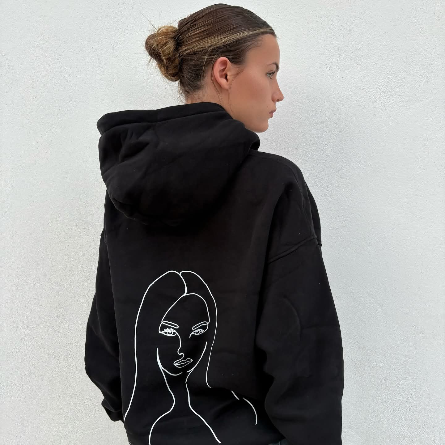 Zita La Belle Elite Charlotte Summers black hoodie and pink shirt, casual layered fashion, front view with hood and vibrant colors.