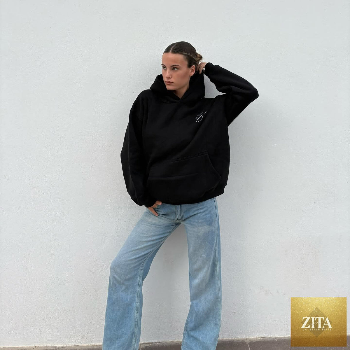 Black Charlotte Summers hoodie and pink shirt from Zita La Belle Elite, featuring casual, comfortable fabric and stylish design.