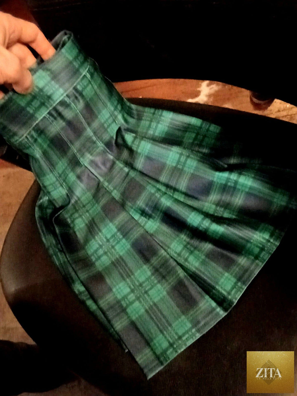 Black and green top and skirt set by Zita La Belle Elite, featuring a stylish coordinated outfit with vibrant color accents.