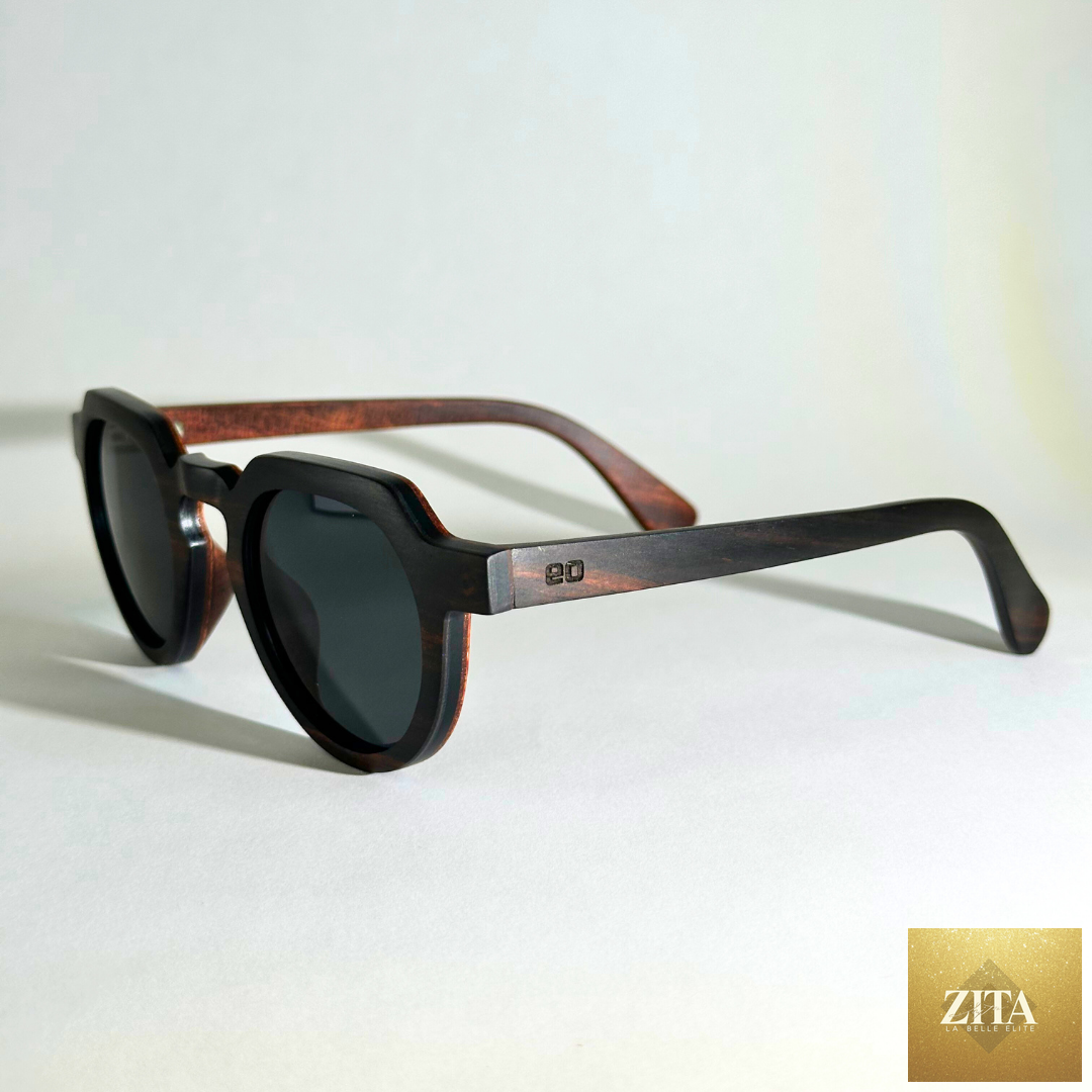 Eastern Outer Wallsburg sunglasses with round wood and carbon fiber frames, shown from a left-angle view.