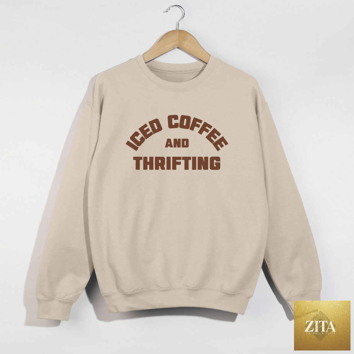 Hey Jude Graphic Tees iced coffee and thrifting crewneck sweatshirt in neutral tones, casual and cozy for thrift girl style.