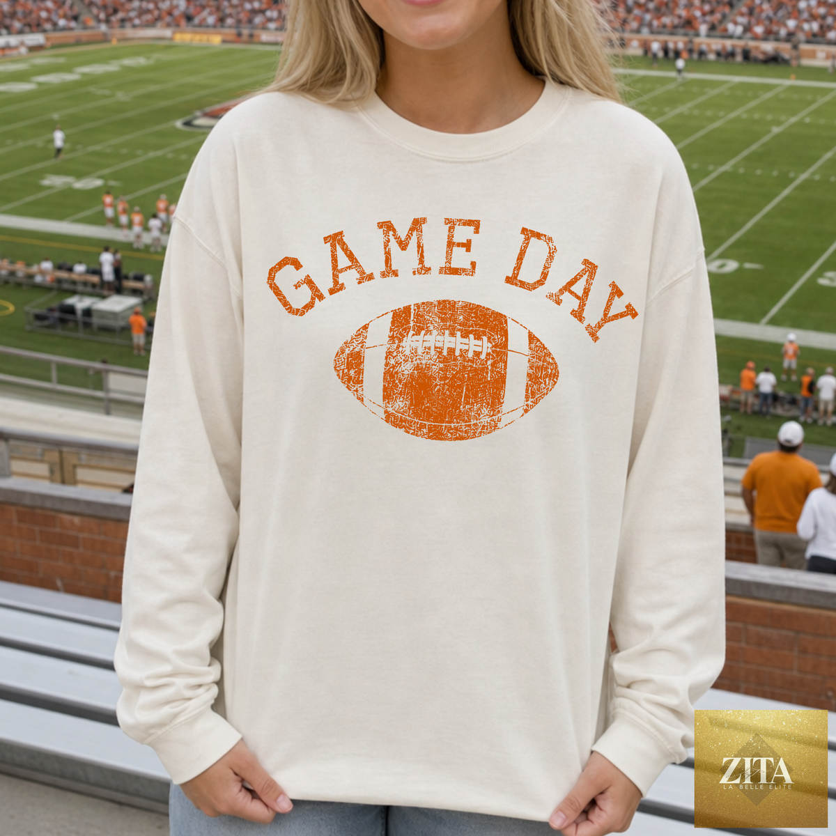 Vintage game day football sweatshirt in custom team colors by Hey Jude Graphic Tees, featuring a sandshell burn orange design.