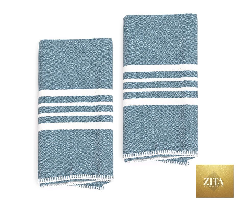 Turkish towel from Zita La Belle Elite with no fringe, featuring a soft blue farm house design, shown in the image.