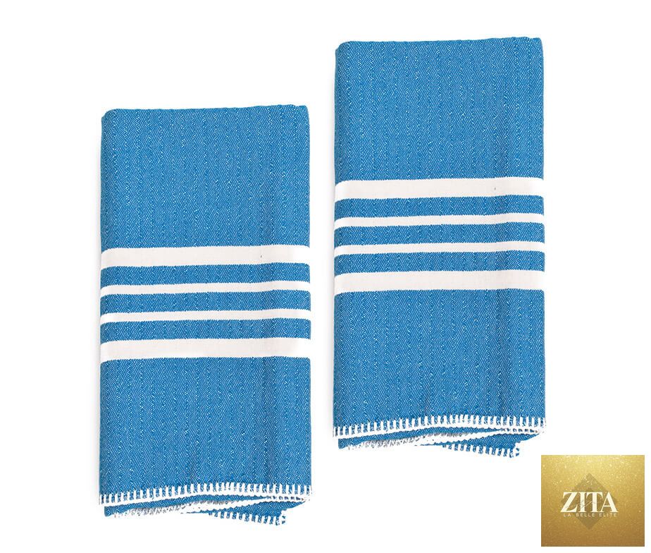 Blue Turkish towel by Zita La Belle Elite, farm house style, without fringe, shown in a bundle with soft, woven texture.