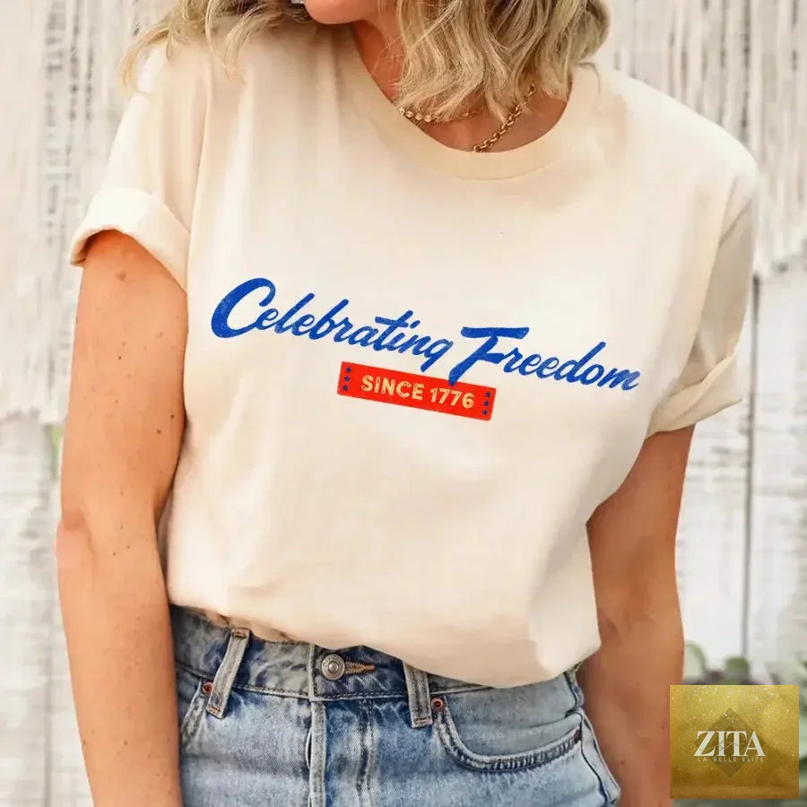 Soft cream 4th of July T-shirt by Adorb Custom Tees featuring patriotic design celebrating freedom since 1776.