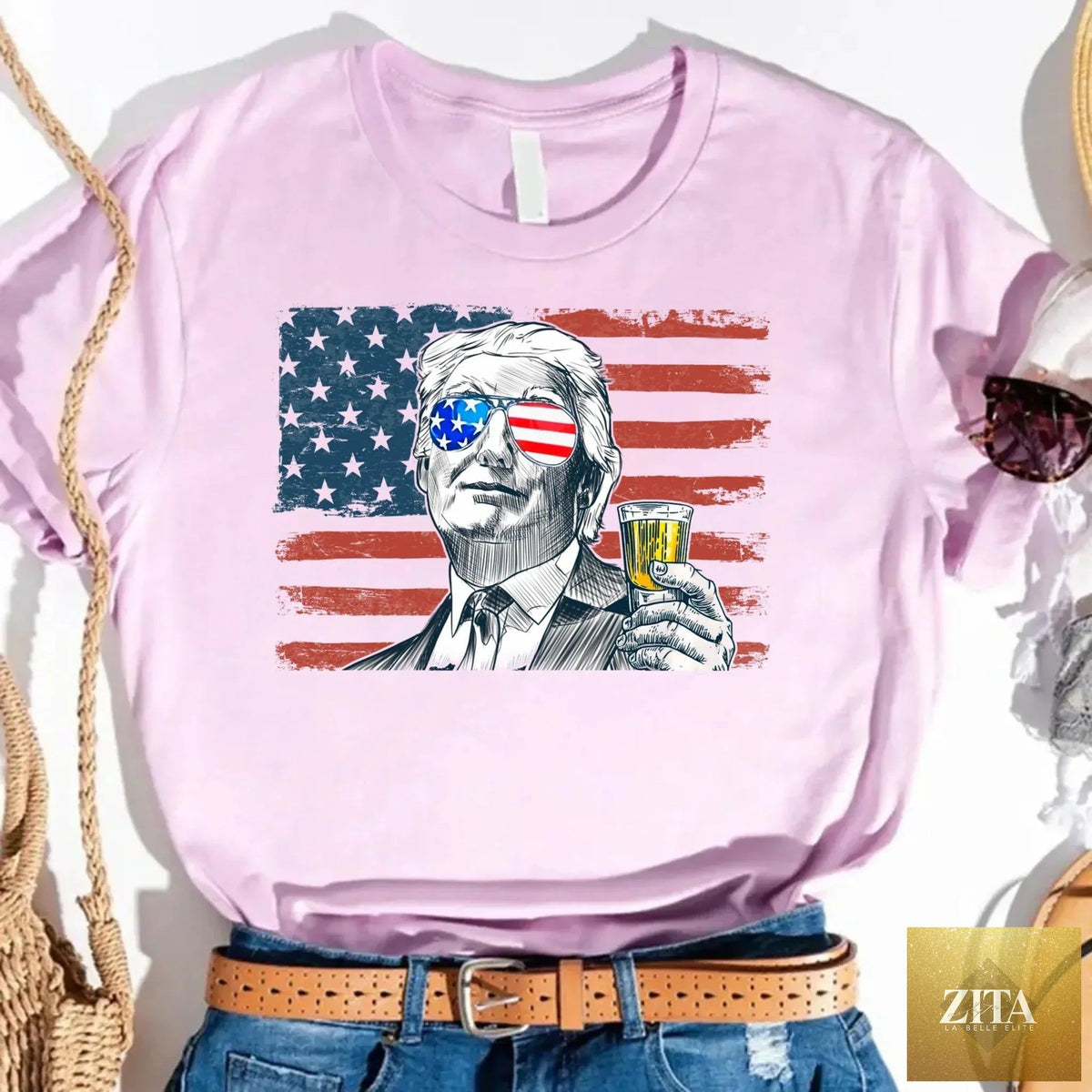 Unisex crew neck T-shirt featuring Donald Trump drinking graphic, made by Adorb Custom Tees, in black with bold print.