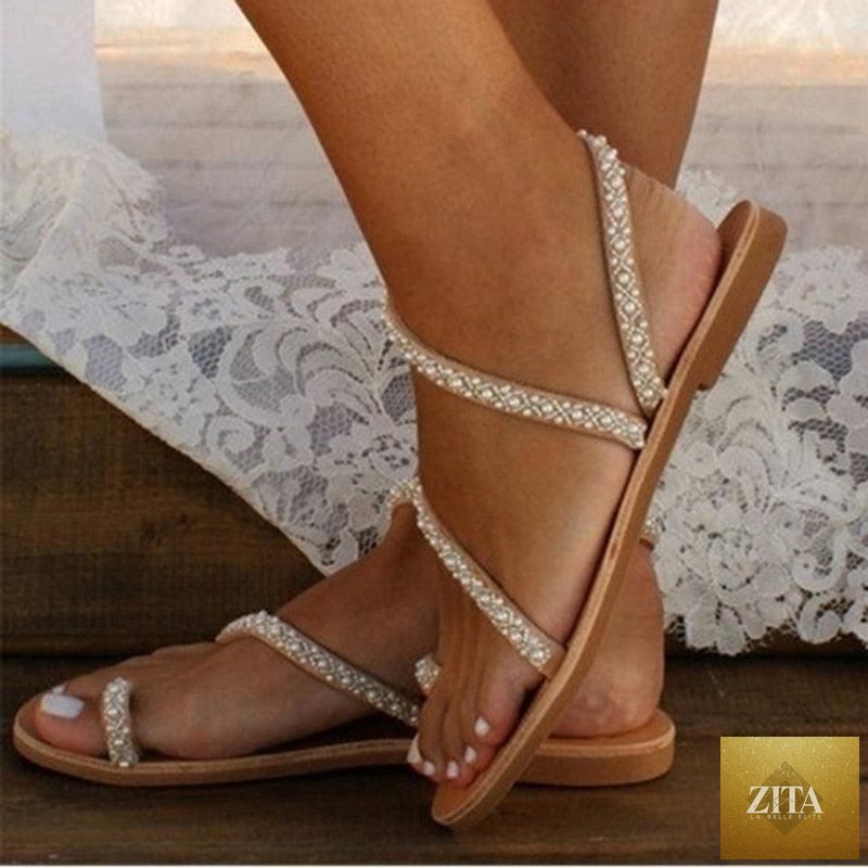 Stevvex summer flat sandals with pearl and rhinestone decorations, open toe leather straps, perfect for beach or holiday wear.