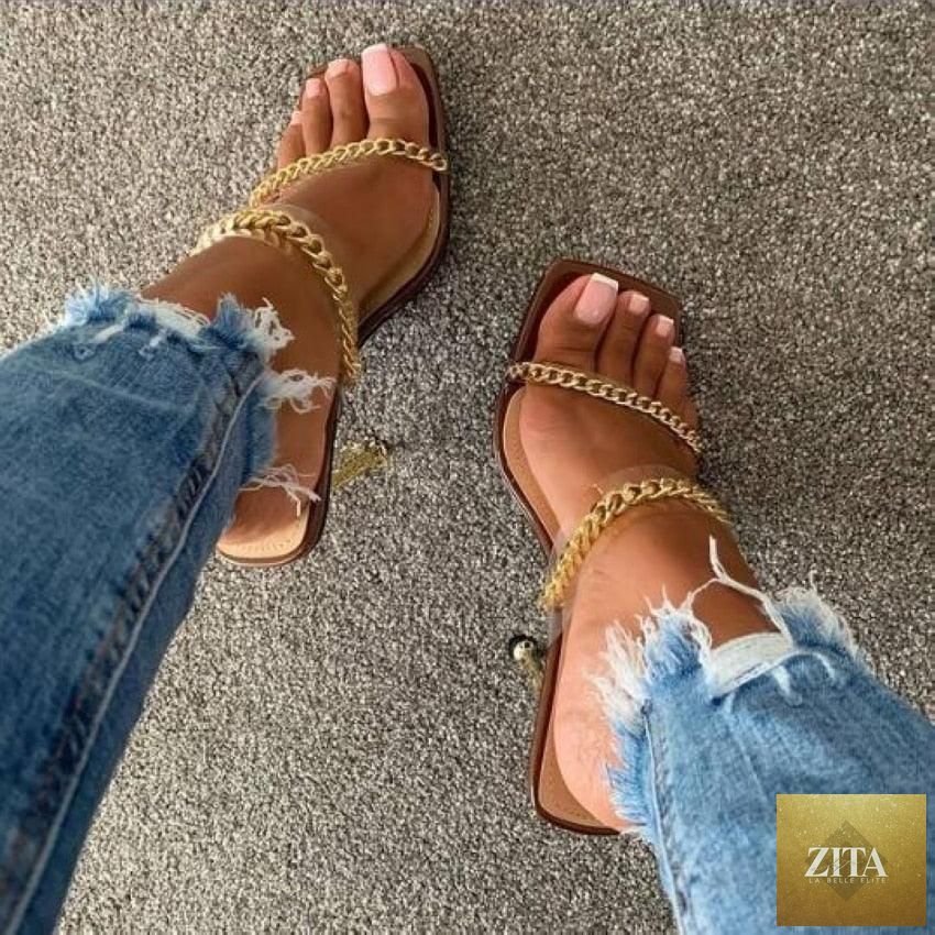 Clear transparent summer women sandals with square toes, high heels, open toes, chain accents, and slip-on design by Stevvex.