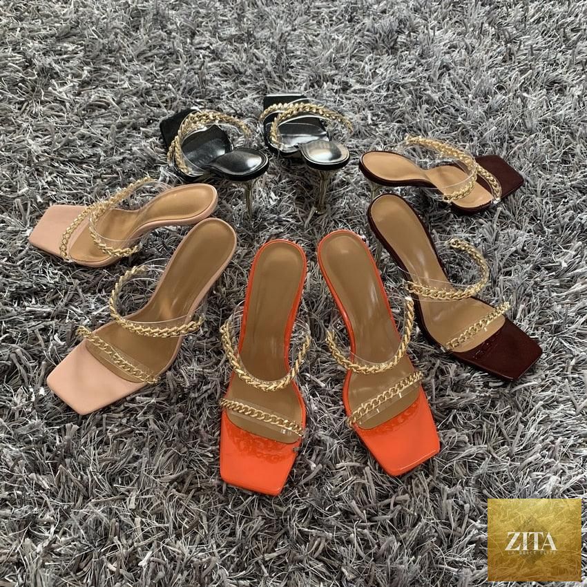 Clear transparent summer women sandals with square toes, high heels, open toes, slip-on design, and fashion chain detail.