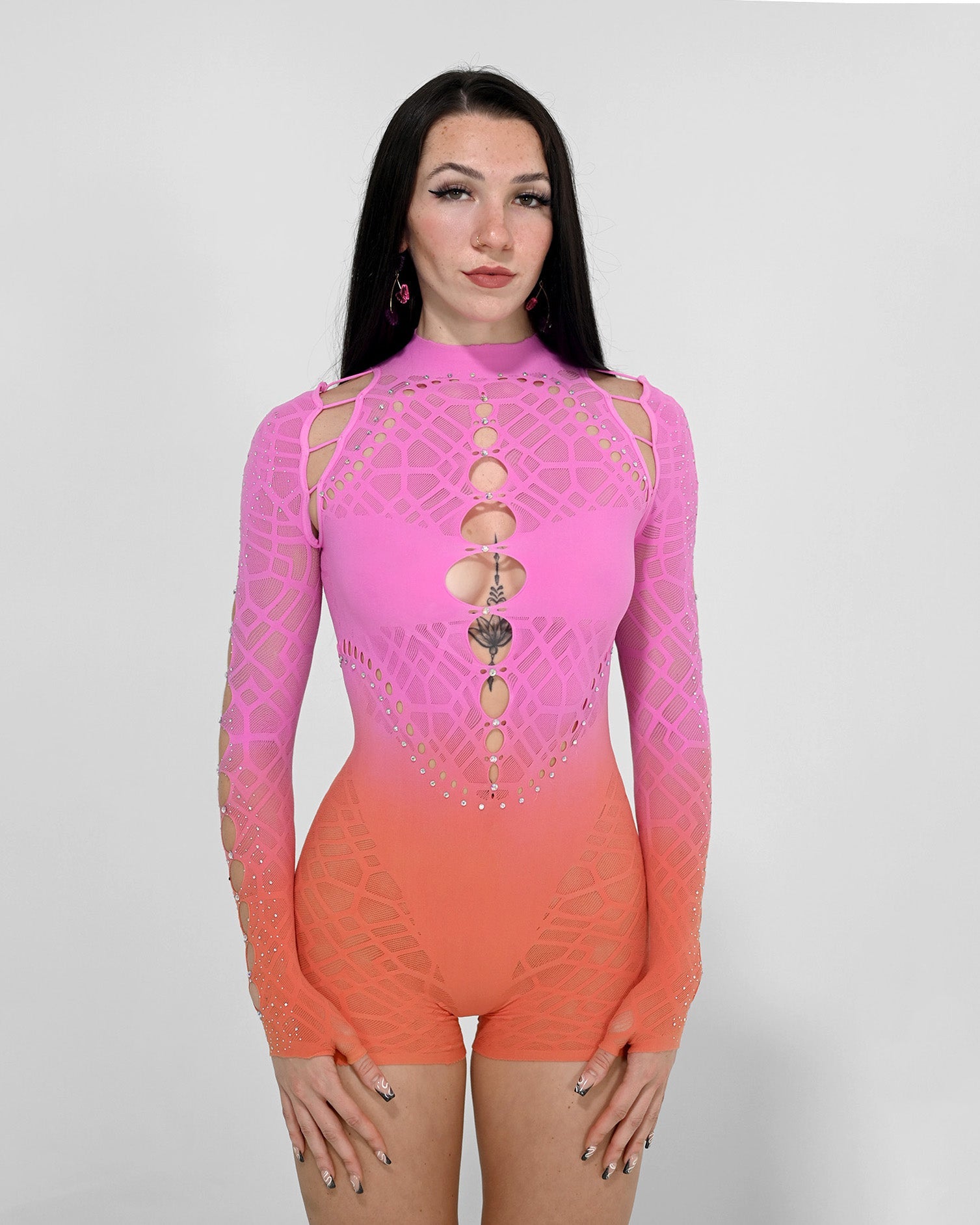 Sunset Rebel Romper by SUSPEX Rave Outfits, a vibrant gradient festival jumpsuit with sunset-inspired colors.