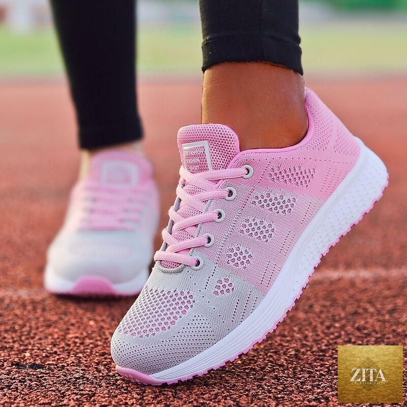 Stevvex women's white sneakers with breathable mesh, casual flat design, vulcanized sole, non-slip, and soft comfortable fit.