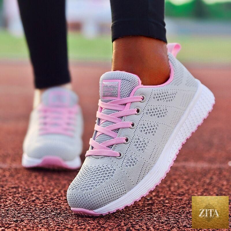 Stevvex white women’s sneakers featuring breathable mesh, casual flats, non-slip soles, and soft, lightweight vulcanize sport design.