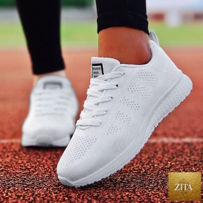 Stevvex women’s white casual sneakers with breathable mesh, soft sole, non-slip outsole, perfect for walking and everyday wear.