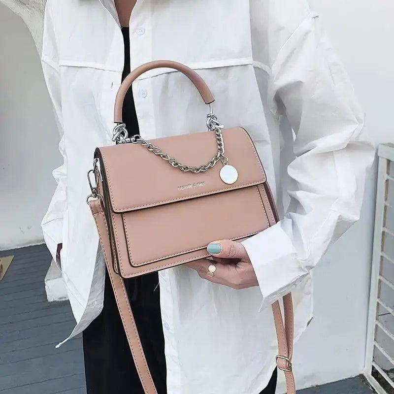 Elegant square women's handbag by Stevvex, made of high-quality PU leather with a stylish design and shoulder strap for travel.