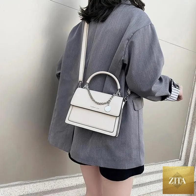 Elegant Stevvex square handbag for women, high-quality PU leather designer travel shoulder bag with stylish design.