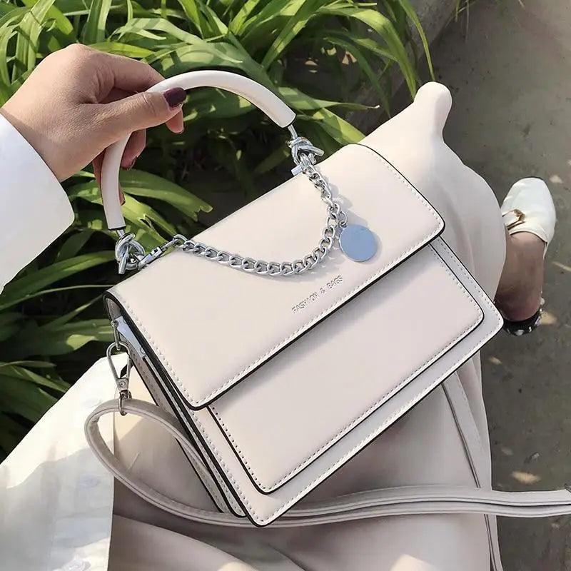 Elegant square women's handbag by Stevvex, made of high-quality PU leather, perfect for travel and daily use.