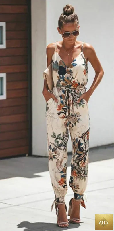 Women’s backless floral print jumpsuit with slit design, stylish and elegant, perfect for summer or casual occasions.
