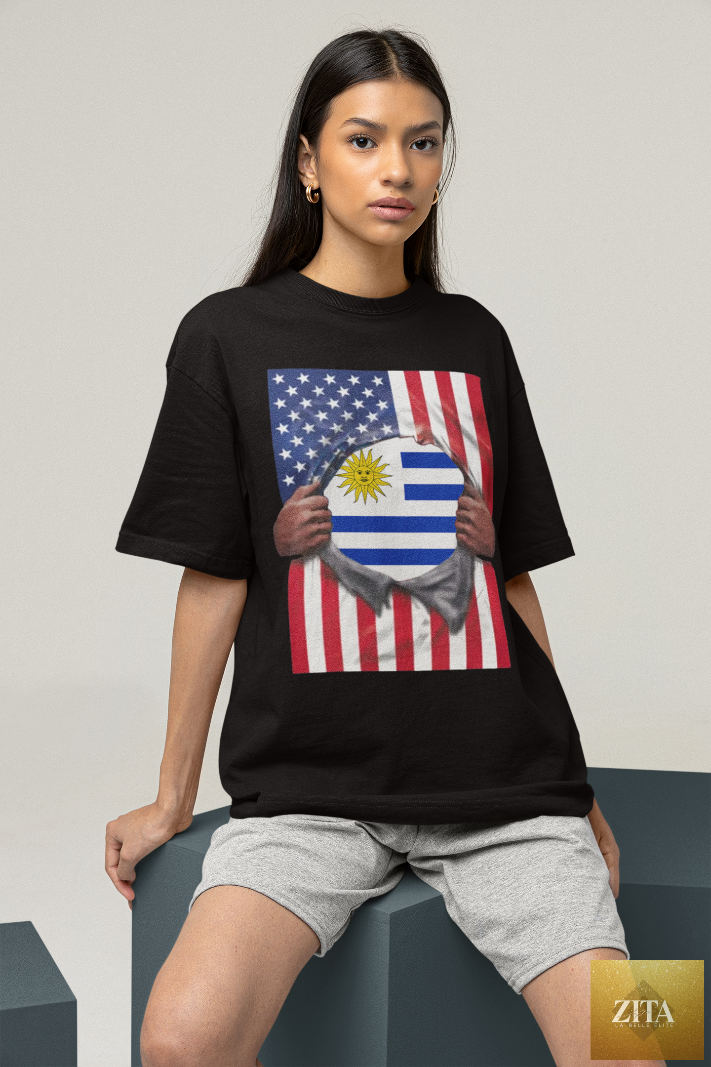 Woman wearing Latinos 4 The World Uruguay and USA flag pride T-shirt, showcasing colorful flag designs on heavyweight cotton tee.