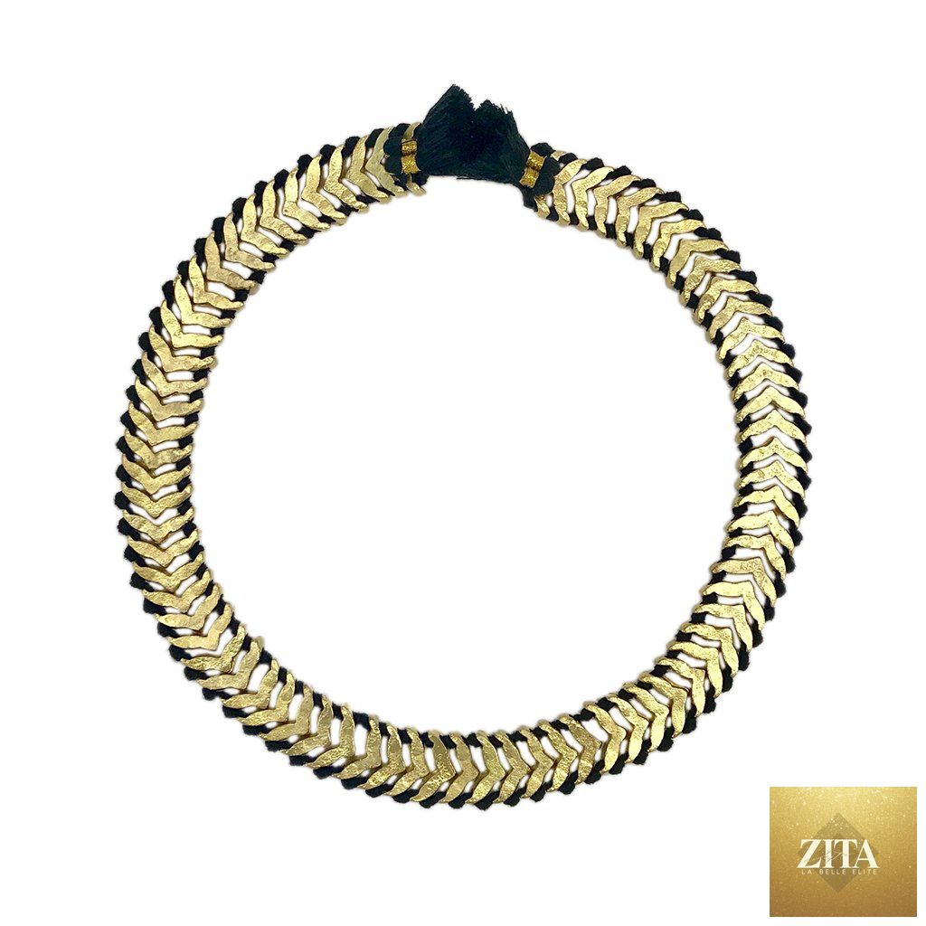 Boho tribal statement necklace with gold and black temple collar design, cotton tassels, and zinc alloy details.
