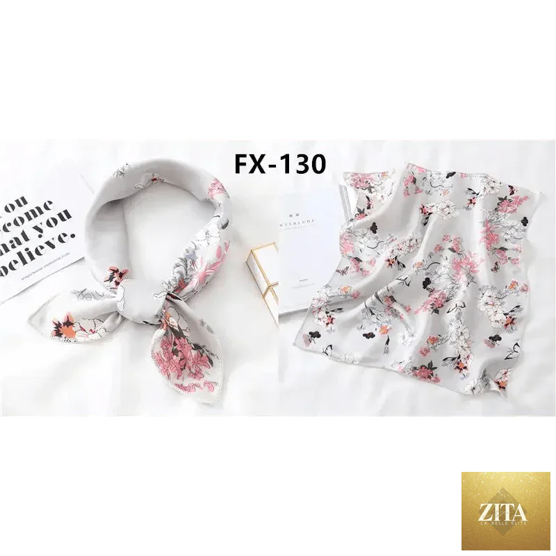 Fashionable square silk scarf for women featuring colorful printed design, versatile accessory for neck, hair, or shawl styling.