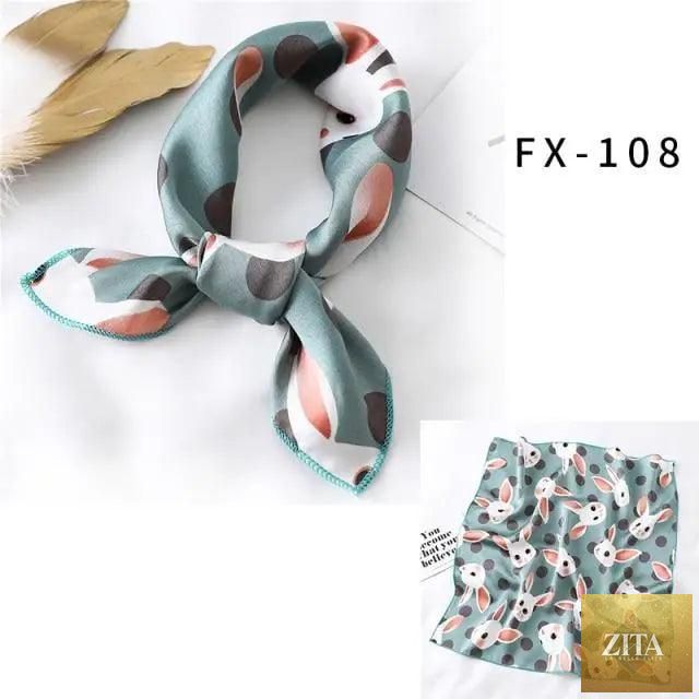 Stevvex square silk scarf for women, printed and versatile, worn as a small neck scarf, bandana, or hair accessory.