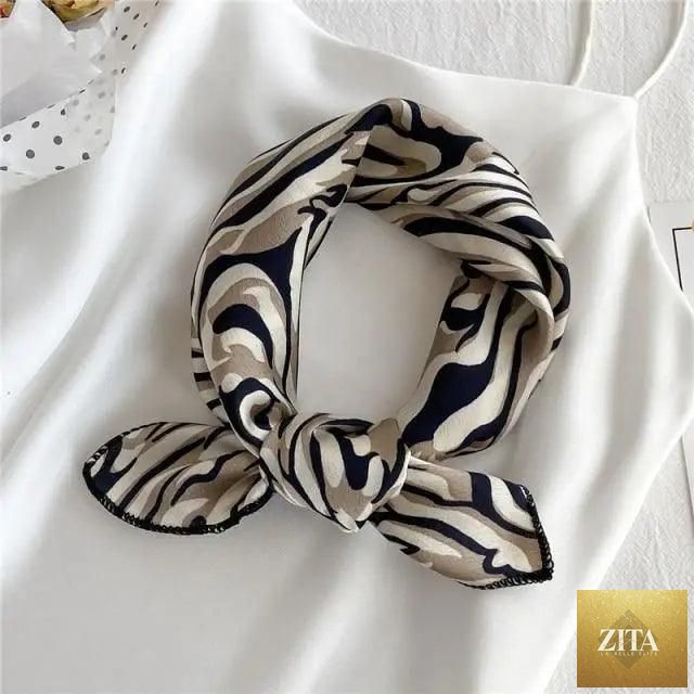 Stevvex square silk scarf for women featuring a colorful printed design, versatile for neck wear, hair band, or shawl styling.