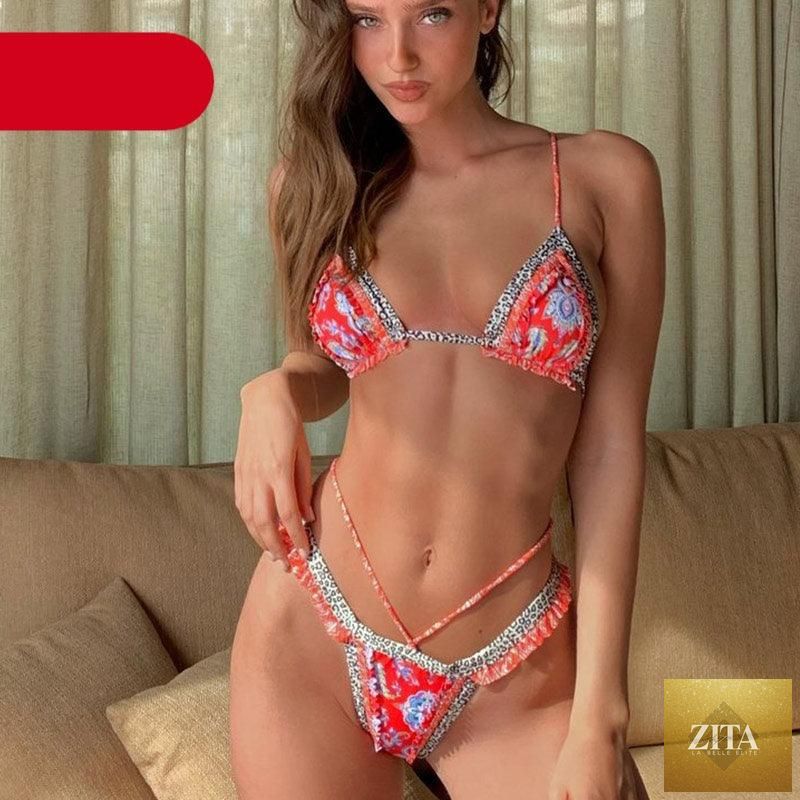 Vintage print female bikini by Stevvex, high-cut two-piece swimsuit with ruffles, string halter top, and triangle bikini design.