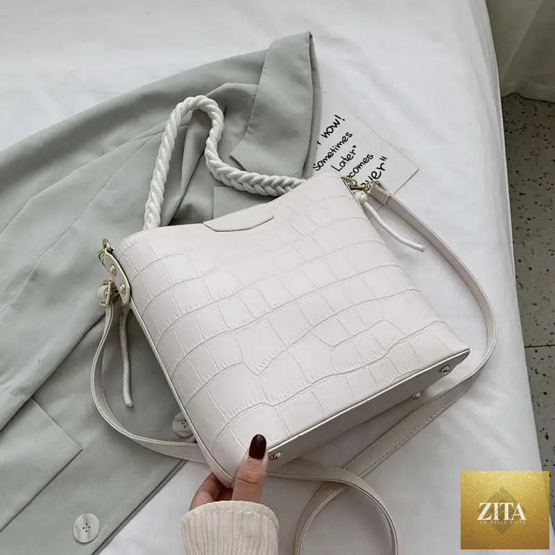 Elegant vintage women's bucket bag by Stevvex with genuine leather, stone pattern shoulder design for stylish ladies.