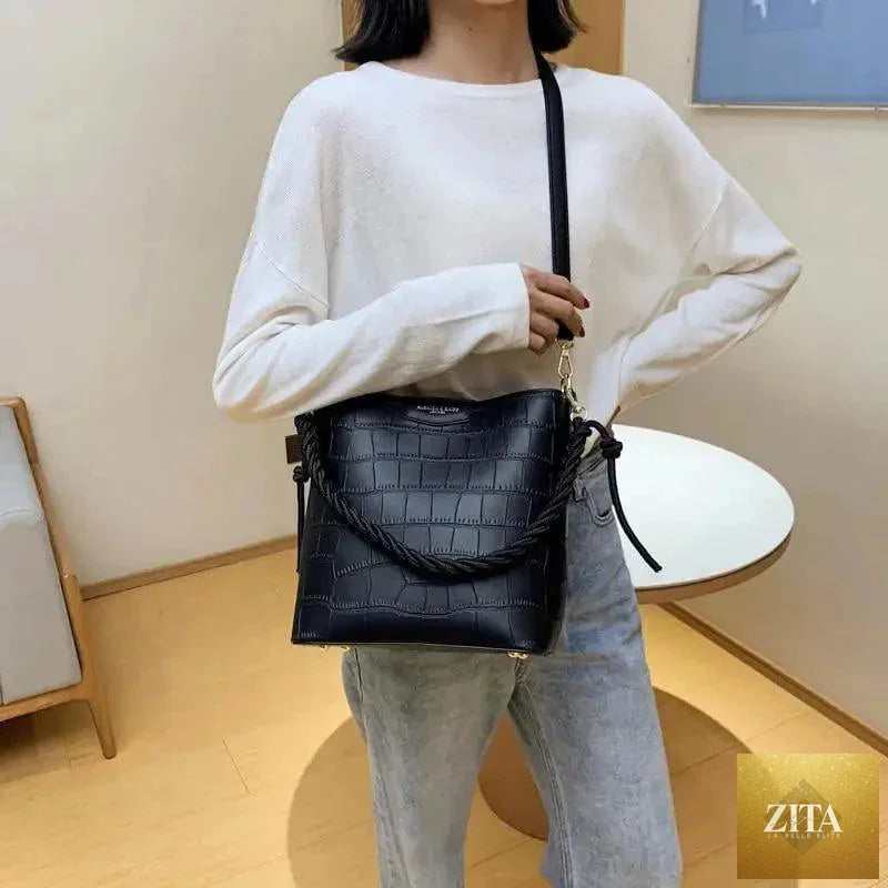 Elegant genuine leather women's bucket bag with a stone pattern, featuring a shoulder strap, by Stevvex in vintage style.
