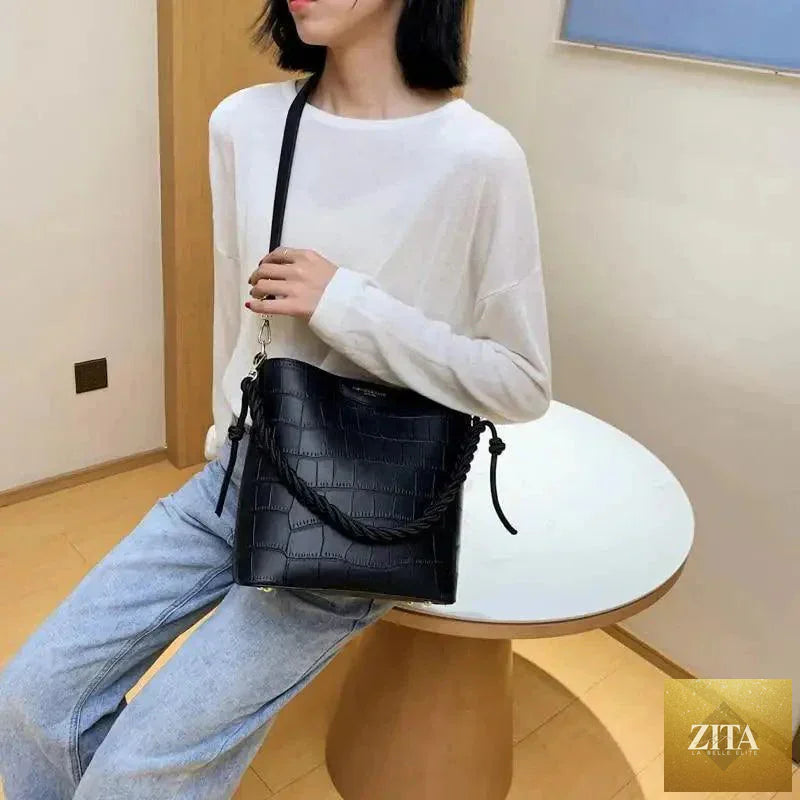 Elegant vintage-style women's leather bucket bag with stone pattern, shoulder strap, from Stevvex, perfect for fashionable ladies.
